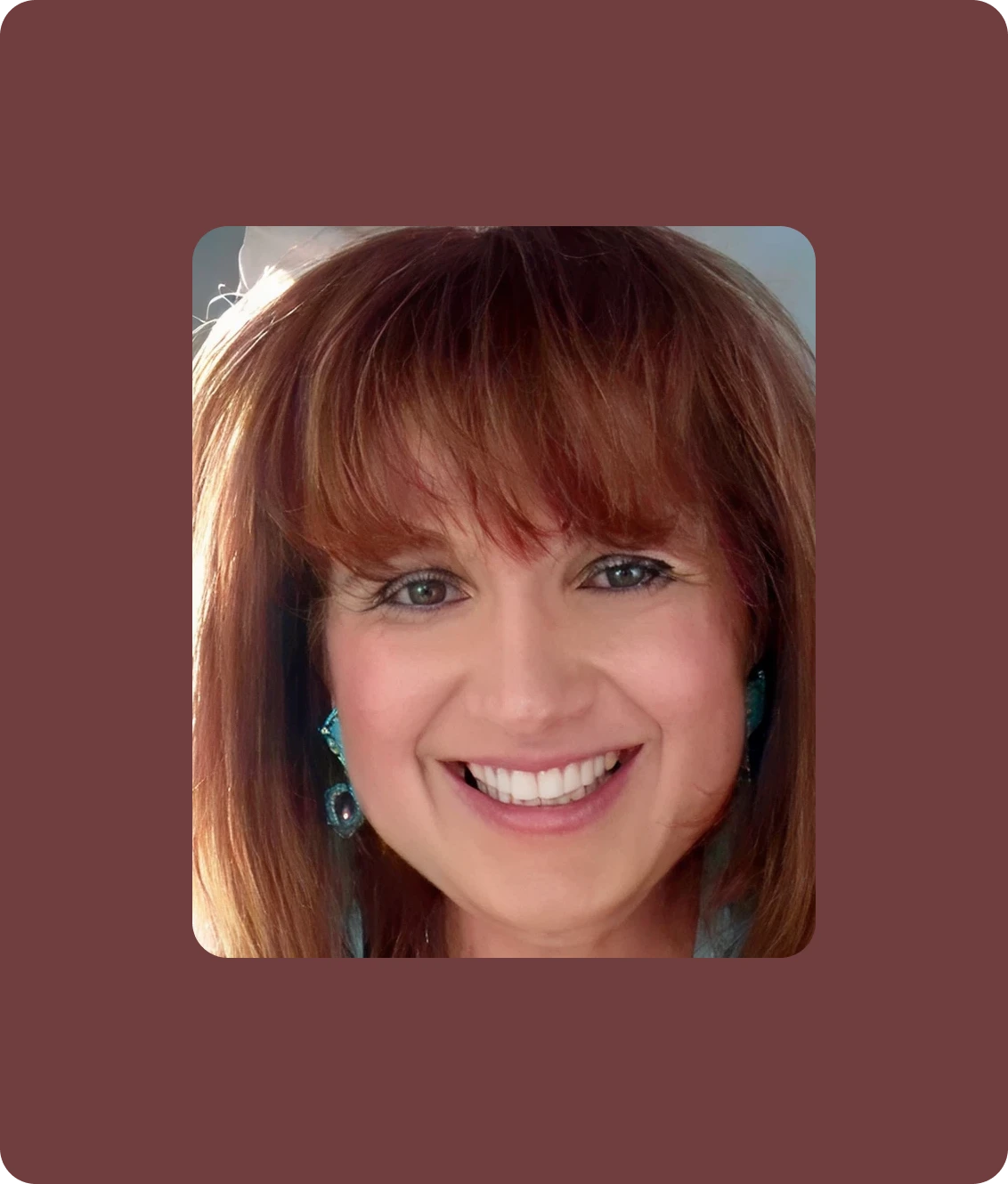 Smiling woman with auburn hair